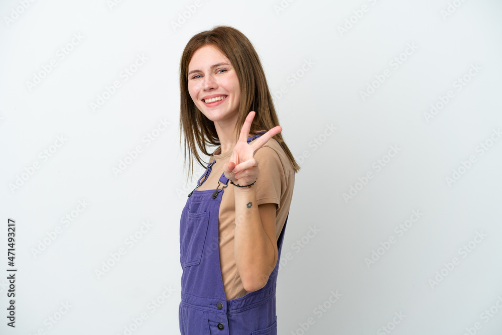 Young English woman isolated on white background smiling and showing victory sign Young English woman isolated on white background smiling and showing victory sign