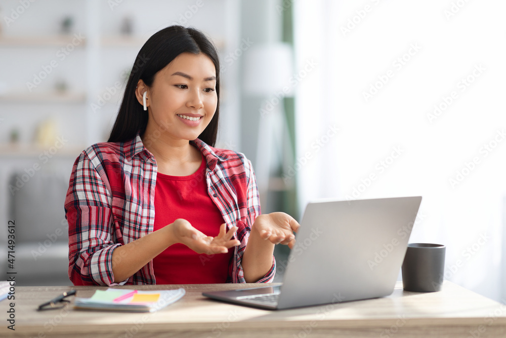 Teleconference Concept. Young Asian Woman Making Video Call On Laptop At Home Teleconference Concept. Young Asian Woman Making Video Call On Laptop At Home