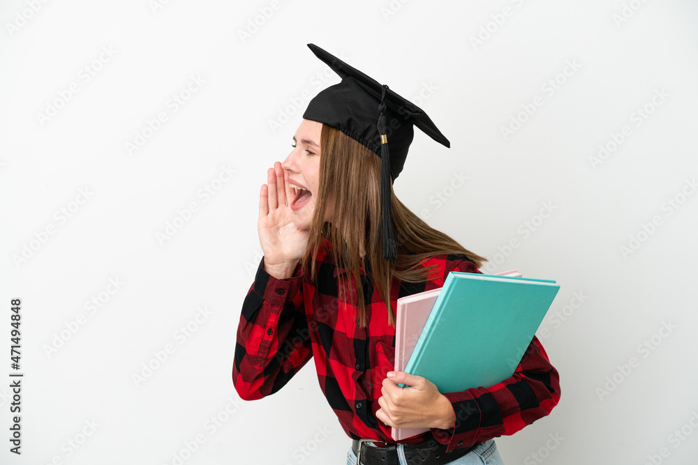 Young English student woman isolated on white background shouting with mouth wide open to the side Young English student woman isolated on white background shouting with mouth wide open to the side