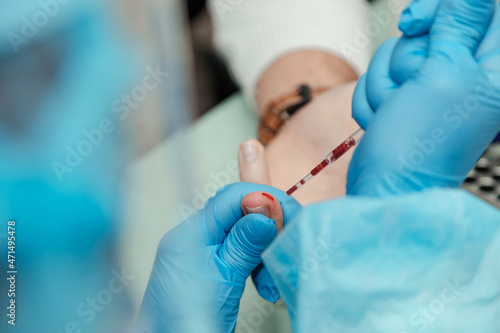 close up of a doctor holding a syringe