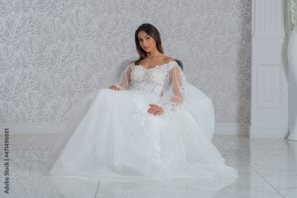 Girl with wedding dress posing for photo shoot Girl with wedding dress posing for photo shoot
