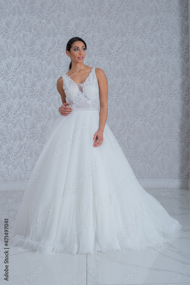 Girl with wedding dress posing for photo shoot Girl with wedding dress posing for photo shoot