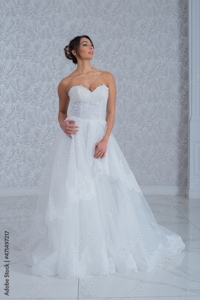 Girl with wedding dress posing for photo shoot Girl with wedding dress posing for photo shoot