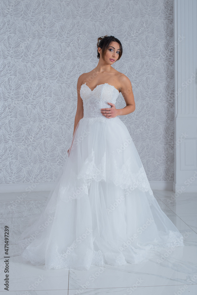 Girl with wedding dress posing for photo shoot Girl with wedding dress posing for photo shoot