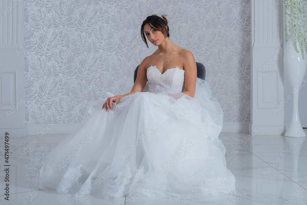 Girl with wedding dress posing for photo shoot Girl with wedding dress posing for photo shoot