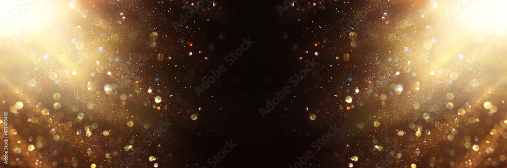 background of abstract gold and black glitter lights. defocused background of abstract gold and black glitter lights. defocused