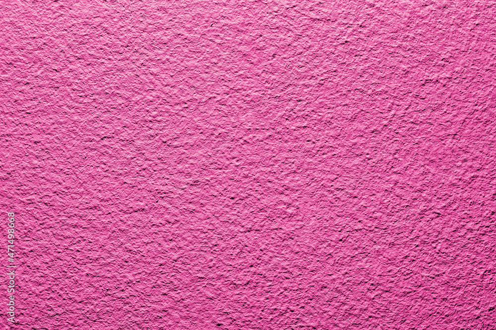 Pink wall background. Vibrant color cement texture. Plaster wall pattern. Spray paint backdrop. Pink wall background. Vibrant color cement texture. Plaster wall pattern. Spray paint backdrop.