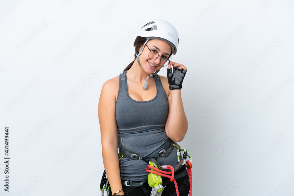 Young Ukrainian rock climber woman isolated on white background with glasses and happy Young Ukrainian rock climber woman isolated on white background with glasses and happy