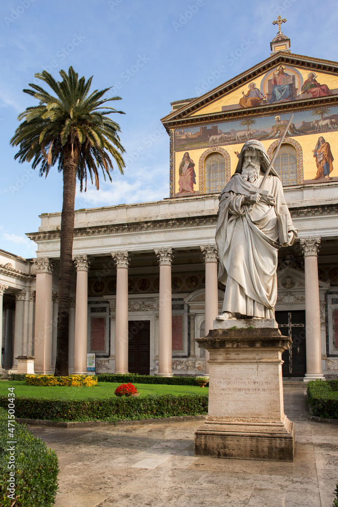 Fototapeta premium Exterior of the papal basilica of Saint Paul Outside the Walls in Rome, Italy. The facade above the colonnade is decorated with mosaics made in the 19th century.