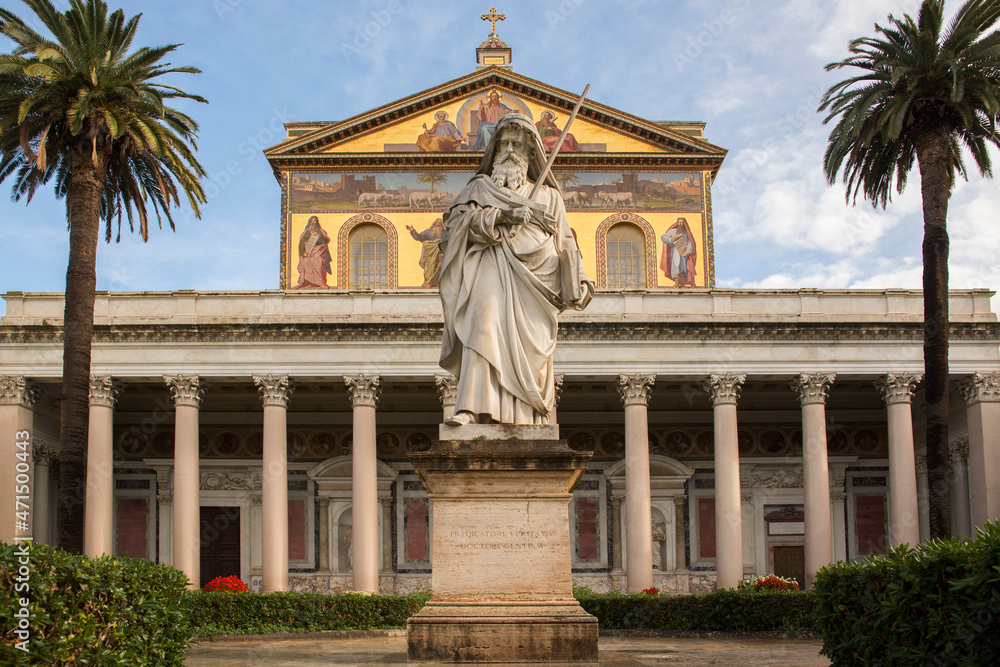 Exterior of the papal basilica of Saint Paul Outside the Walls in Rome, Italy. The facade above the colonnade is decorated with mosaics made in the 19th century.