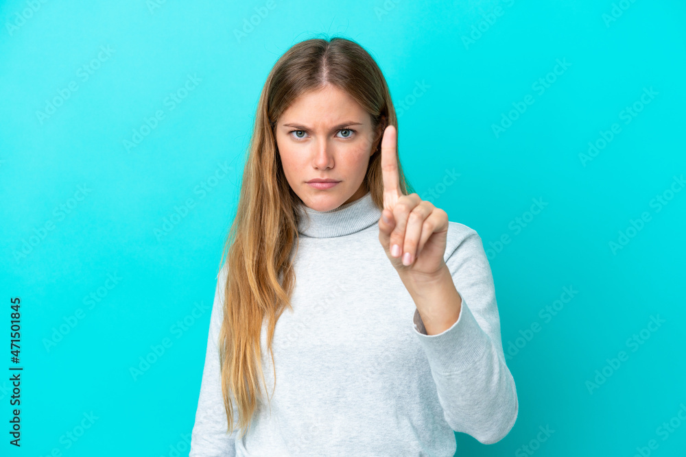 Fototapeta premium Young blonde woman isolated on blue background counting one with serious expression