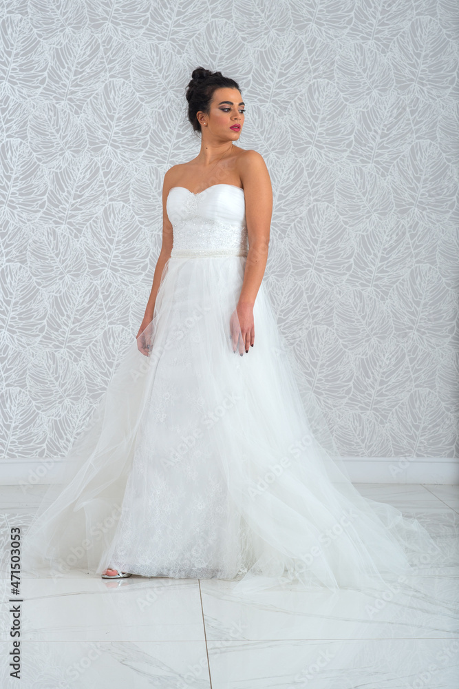 Girl with wedding dress posing for photo shoot Girl with wedding dress posing for photo shoot