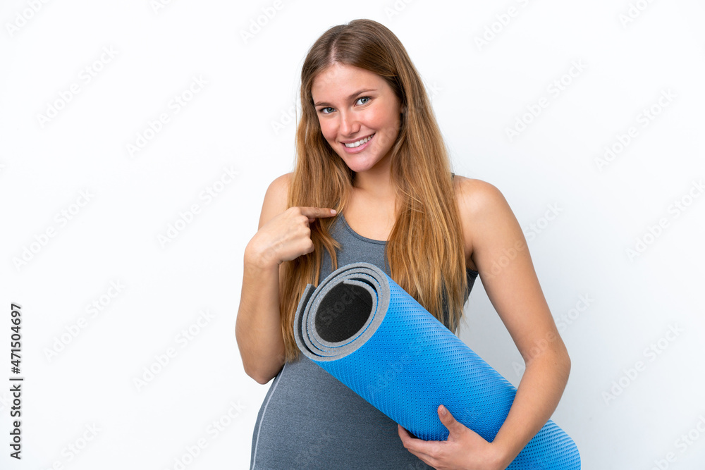 Young sport woman going to yoga classes while holding a mat with surprise facial expression Young sport woman going to yoga classes while holding a mat with surprise facial expression