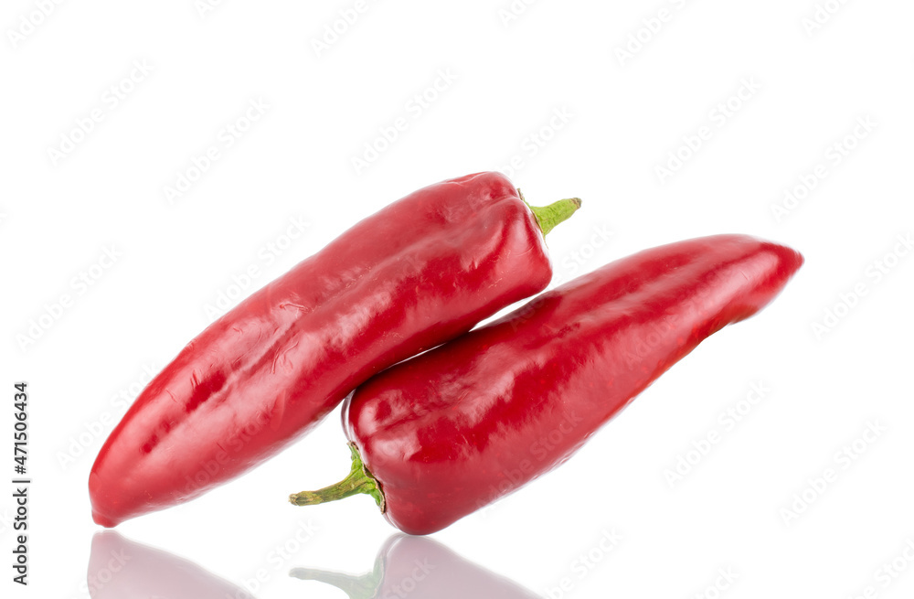 Two red sweet peppers, close-up, isolated on white.