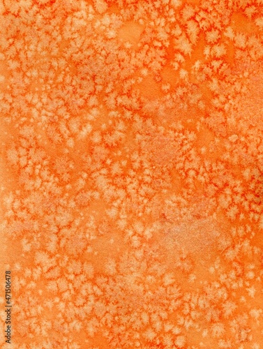 Bright watercolor textured orange background with small specks. Salt Effects