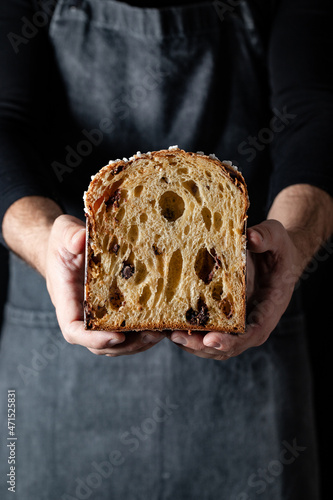 Crop baker showing half of panettone