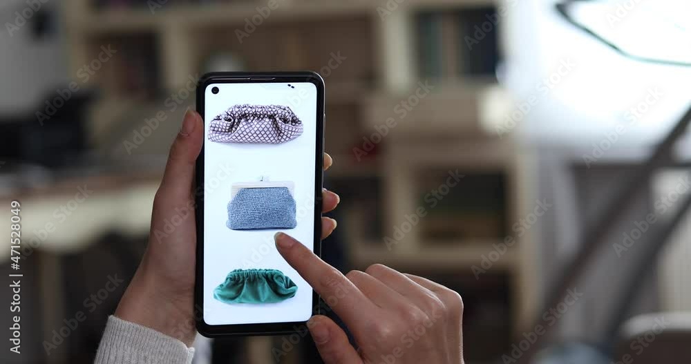 woman searching bag and clothes on mobil application of store