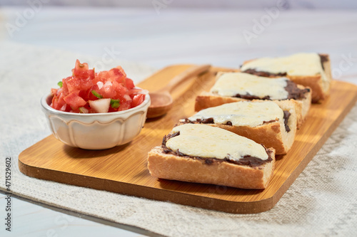 Homemade Mexican molletes. Traditional Mexican food. photo