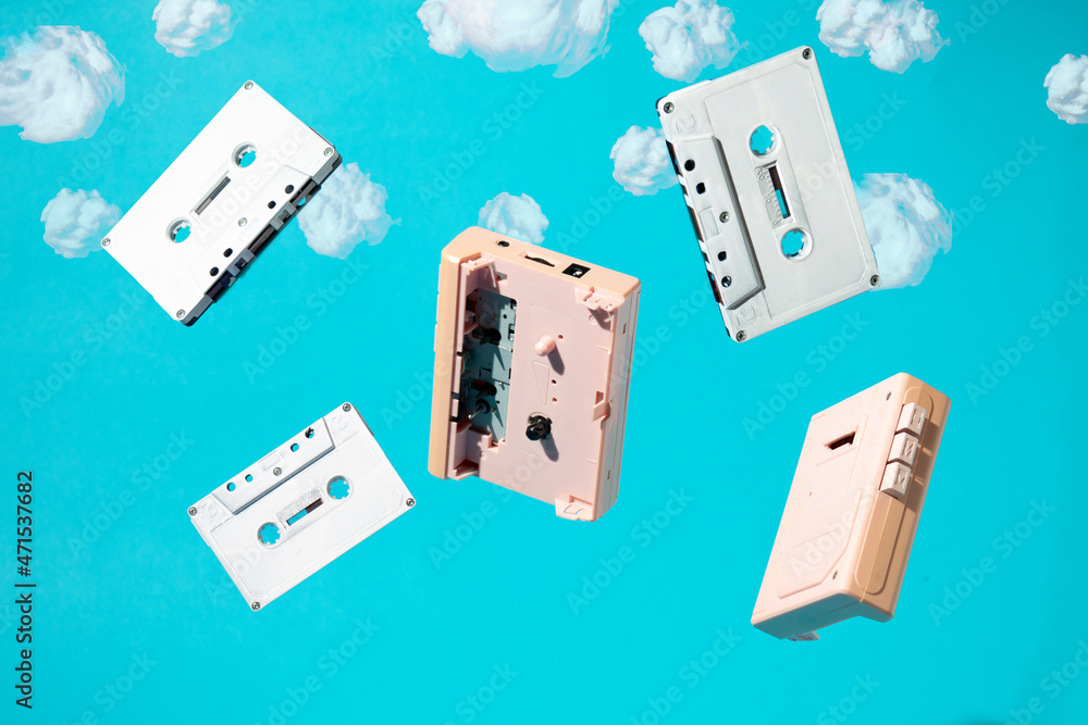 Fototapeta premium Cassettes fall from the sky. Minimal retro aesthetic concept.