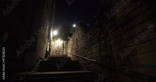 Dark stairs leading to castle in Edinburgh at night can be dangerous if you're alone or not paying attention. Night streets of Scottish capital, Edinburgh, would make a great setting for horror movie photo