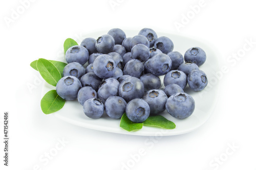 Blueberries in a plate on white background