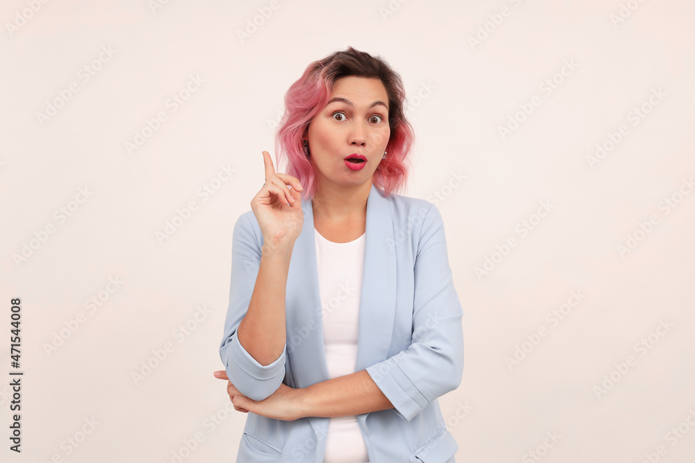 Portrait of serious stylish girl raises finger up, says: Attention please! Portrait of serious stylish girl raises finger up, says: Attention please!