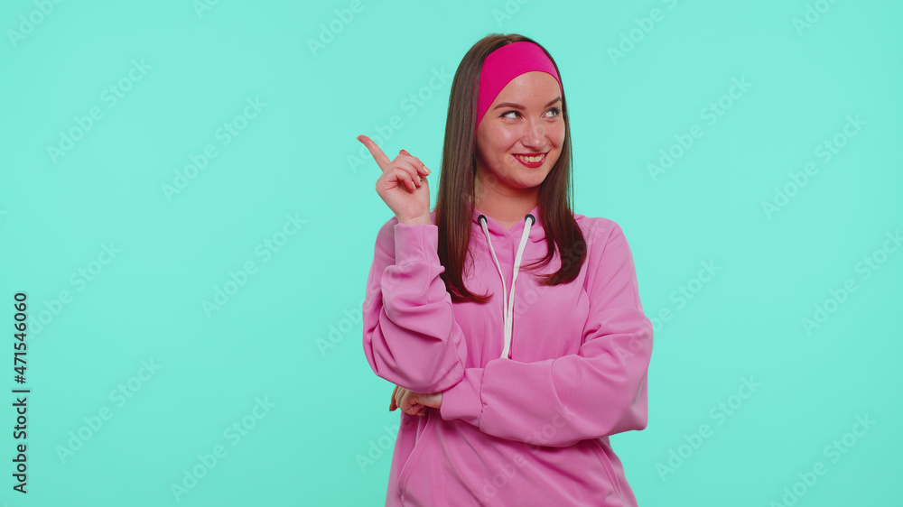 Villain idea. Sneaky teenager student girl conspiring scheming, thinking over tricky plan with cunning expression, pondering revenge or evil joke prank. Young woman isolated on blue wall background Villain idea. Sneaky teenager student girl conspiring scheming, thinking over tricky plan with cunning expression, pondering revenge or evil joke prank. Young woman isolated on blue wall background
