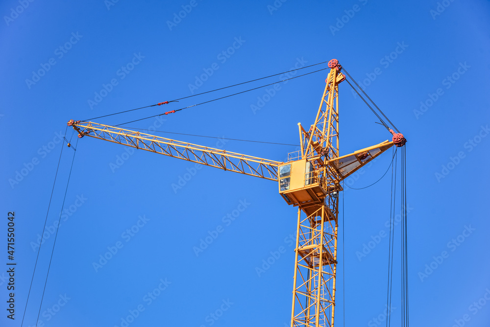 The site with cranes against blue sky