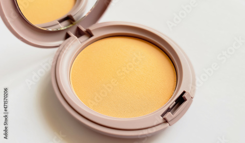 Compact powder for natural color make-up close-up isolated on a white background