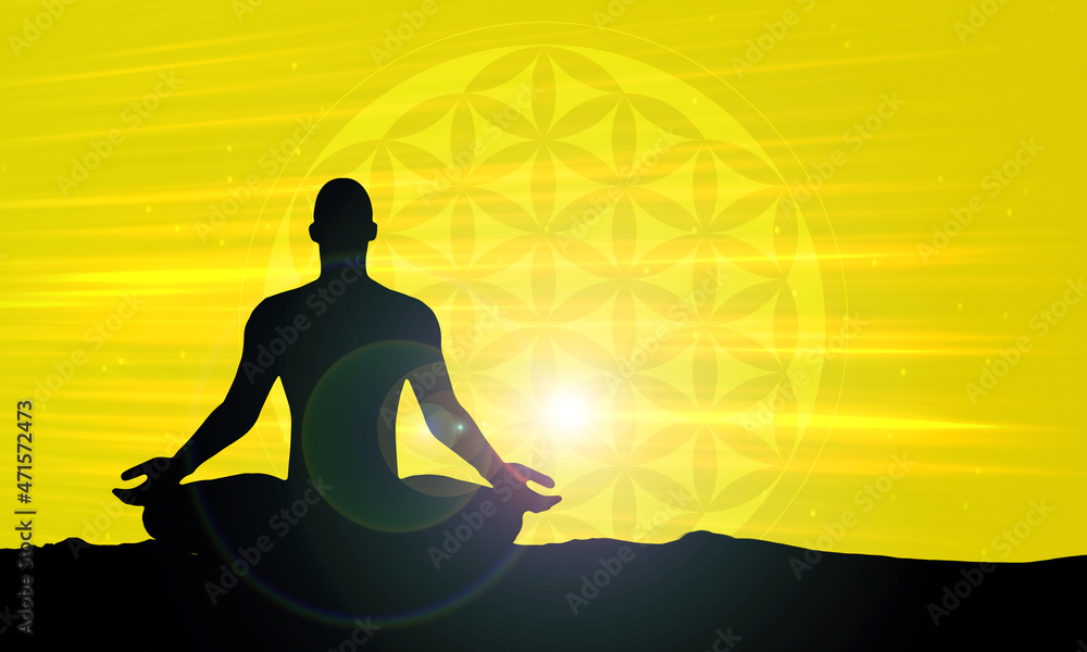 silhouette of a person meditating - yellow light