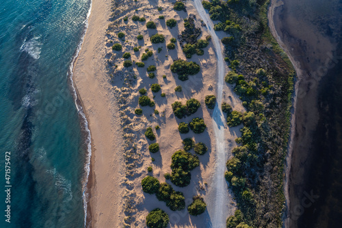 Drone view of Halikounas Beach separated Lake Korission and Ionian Sea on Corfu Island in Greece photo