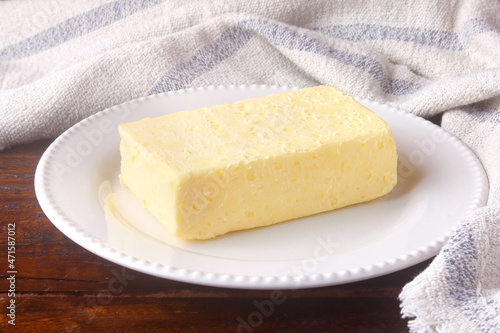 fresh organic farm yellow butter made with cow's milk on rustic wooden table