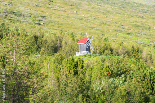 Windmill in the forests of Eskifjordur in Iceland photo