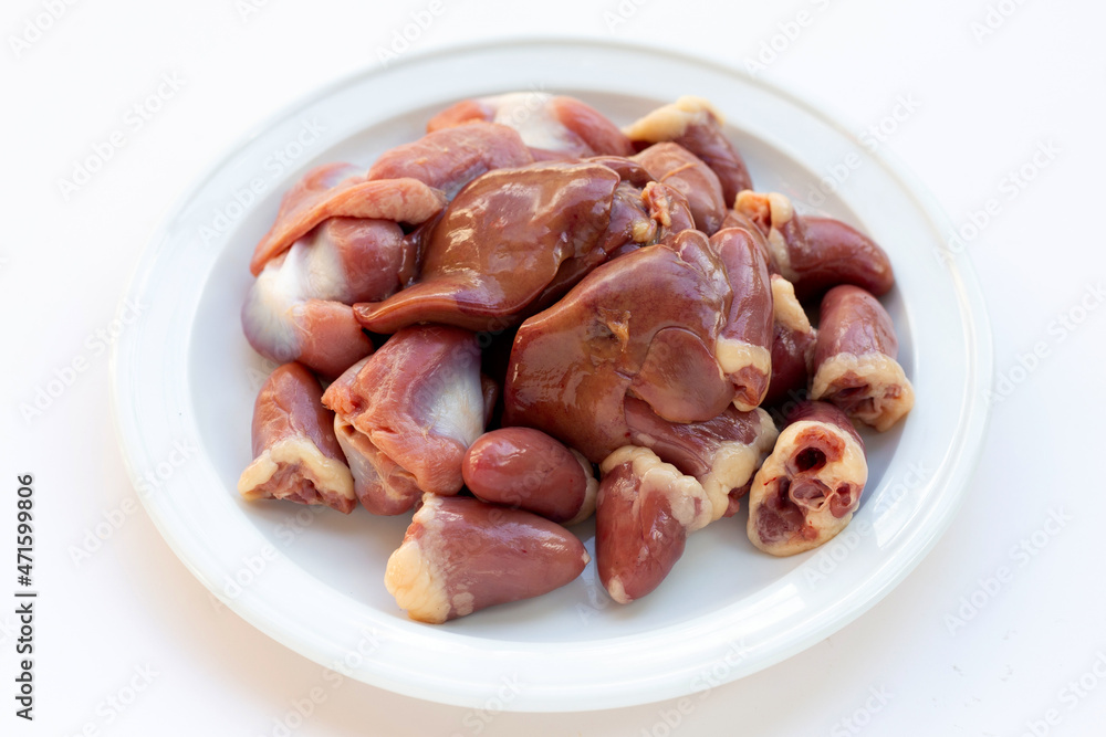 Mixed chicken entrails in white plate Mixed chicken entrails in white plate
