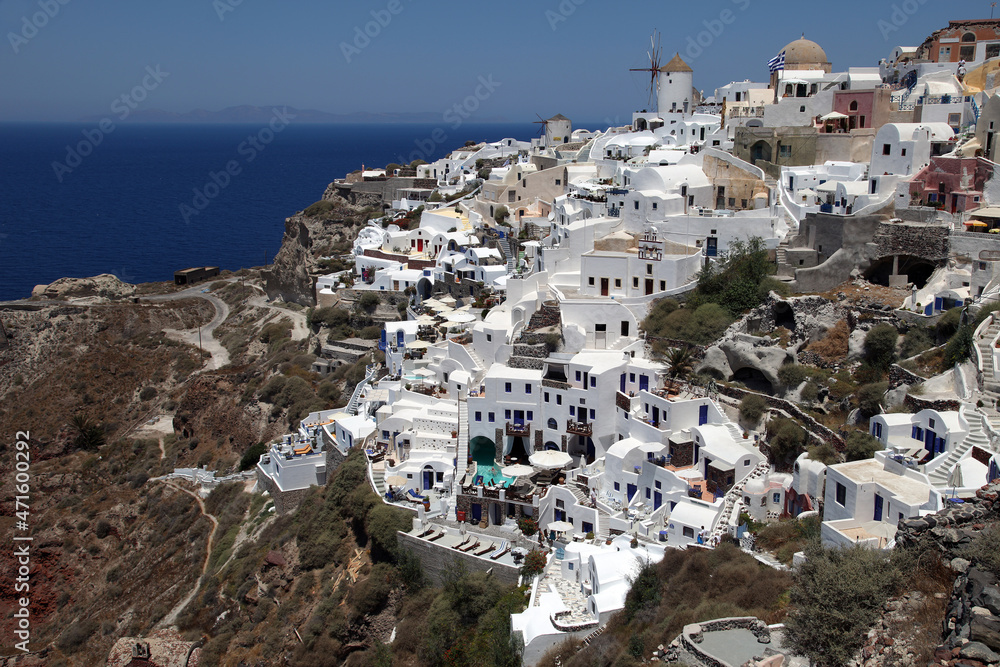 Oia Town and windmill at beautiful Greek island Santorini in Greece. Oia is a small town and former community in the South Aegean on the Santorini.