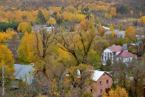 Autumn in a cottage village in the middle of picturesque mountains