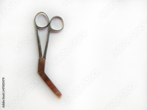 Surgical instrument on white background. Episiotomy Scissor. photo