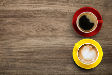 Küchenrückwand glas motiv Kaffee und Kaffeebohnen Black coffee and Latte Coffee or Cappuccino Coffee in red and yellow cup on wooden table, Flay lay wooden desk with coffee with copy space  © nattanapong