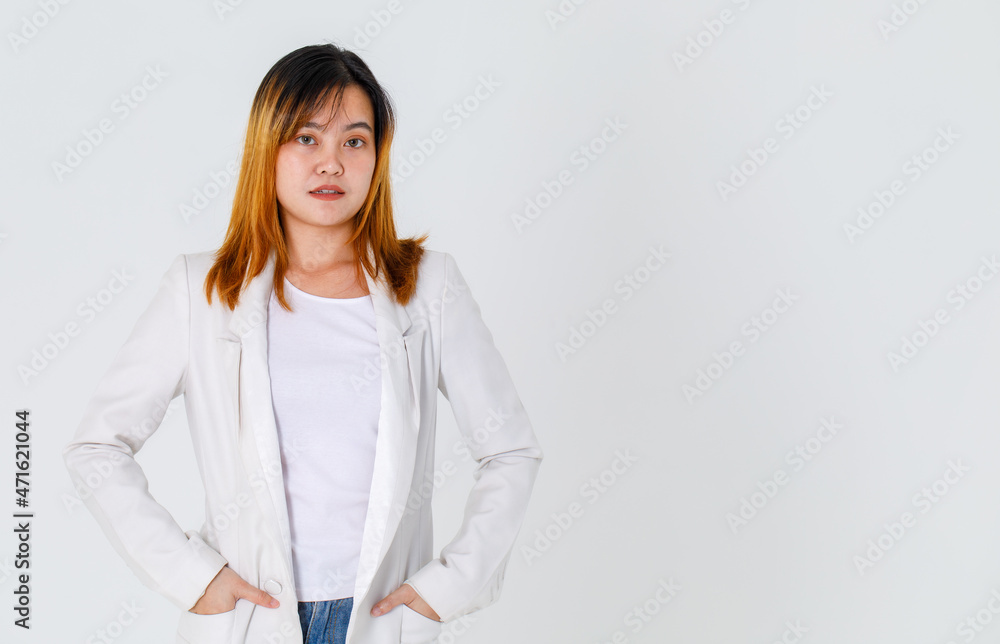 Portrait studio shot of Asian trendy fashionable urban beautiful happy dyed hair female model in casual long suit t shirt and denim jeans standing smiling look at camera posing on white background Portrait studio shot of Asian trendy fashionable urban beautiful happy dyed hair female model in casual long suit t shirt and denim jeans standing smiling look at camera posing on white background