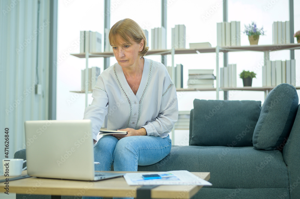 Caucasian senior Businesswoman working in modern office Caucasian senior Businesswoman working in modern office