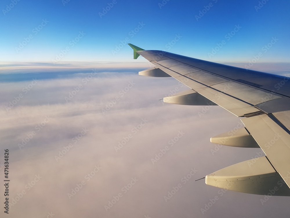 The plane flies in the blue sky The plane flies in the blue sky