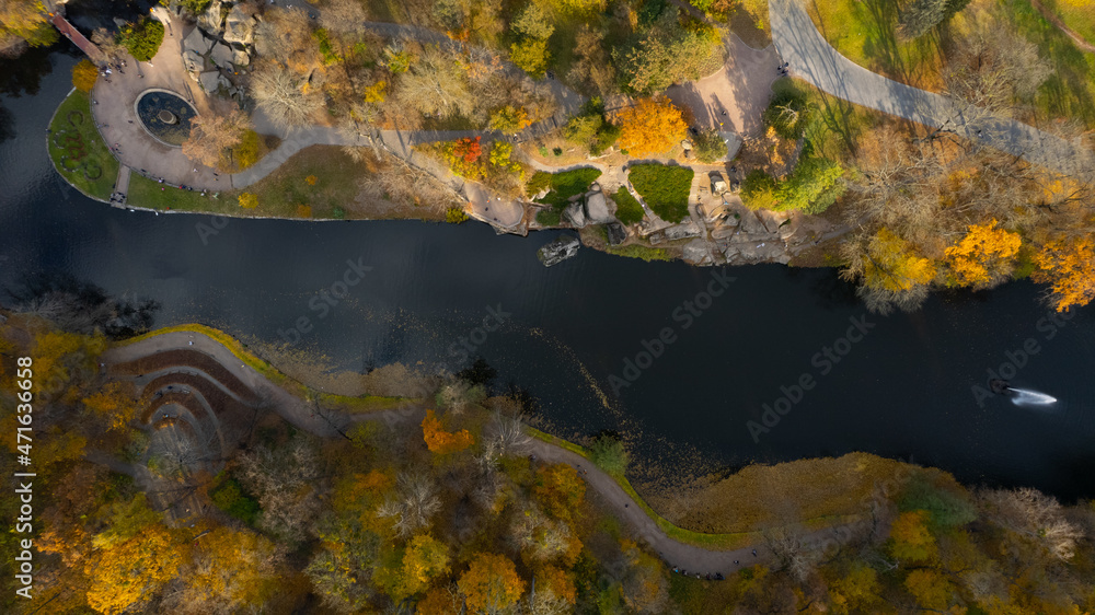 Aerial view of the waterfall in autumn park with big stones, from above. Sofiivka park in Uman, Ukraine