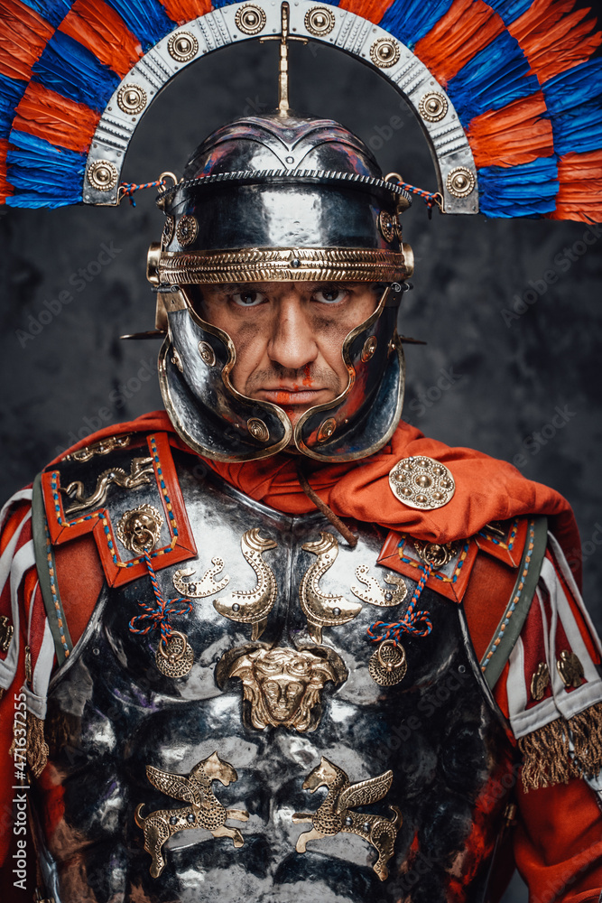 Studio shot of fearful roman soldier with colorful plumed helmet