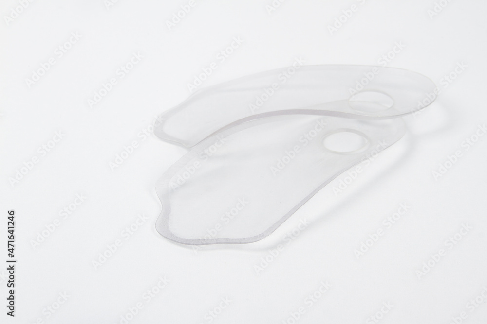 Orthopedic insole on a white background. Treatment and prevention of flat feet and foot diseases. Foot care, comfort for the feet. Wear comfortable shoes. Medical insoles. Flat Feet Correction Orthopedic insole on a white background. Treatment and prevention of flat feet and foot diseases. Foot care, comfort for the feet. Wear comfortable shoes. Medical insoles. Flat Feet Correction