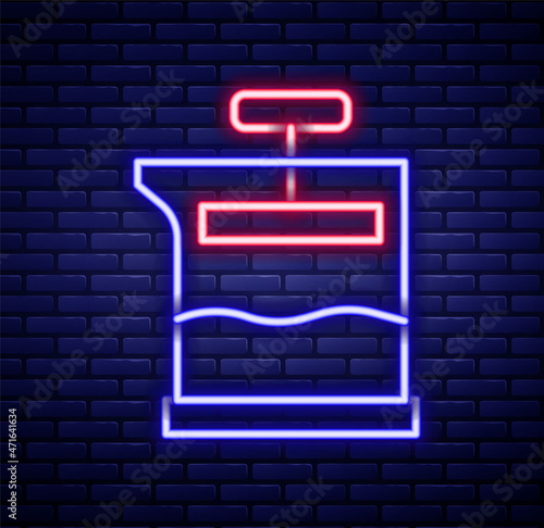 Glowing neon line French press icon isolated on brick wall background. Colorful outline concept. Vector