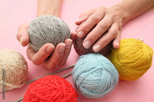 grandmother knits a lot of yarn