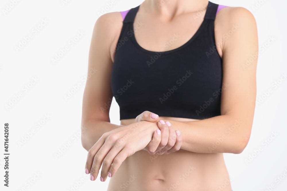 Woman holds hand around thin wrist closeup