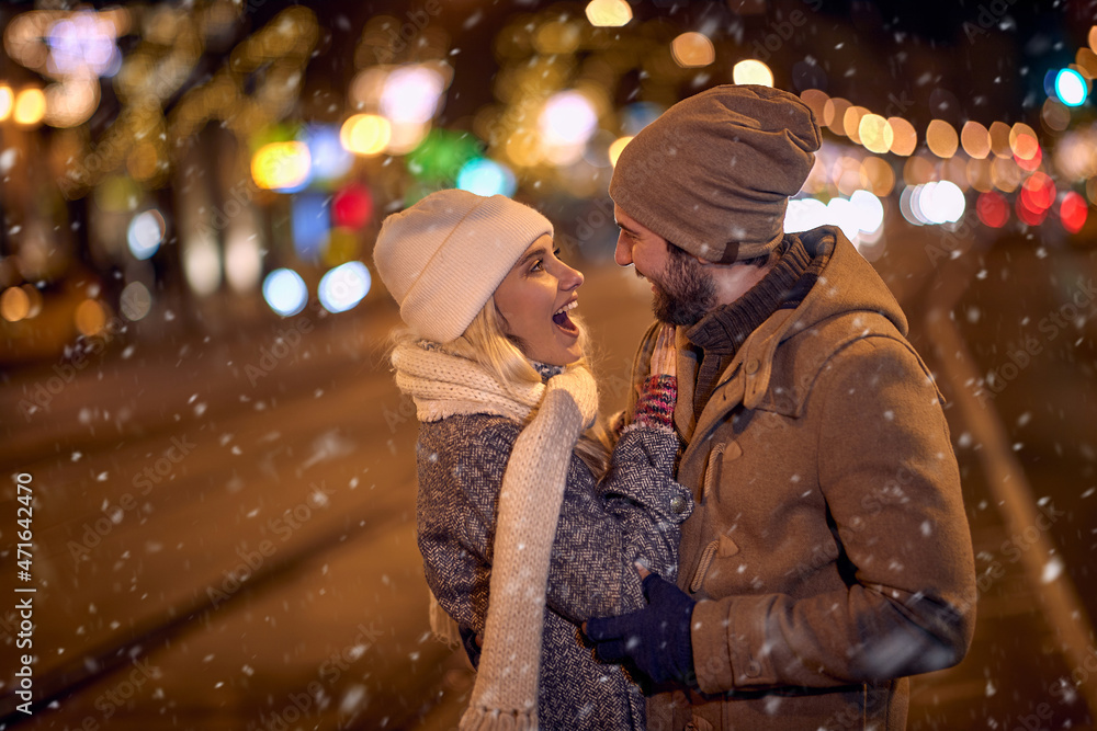 Romance - couple in night winter street Romance - couple in night winter street