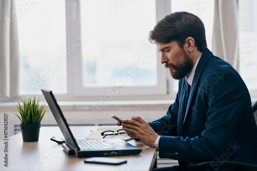 man in front of laptop working in front of laptop technologies success