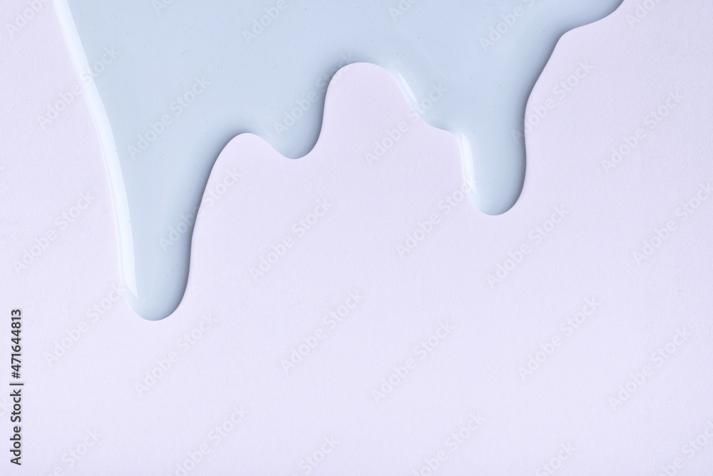Blue liquid drops of paint color flow down on gray background. Abstract backdrop with fluid drip pattern Blue liquid drops of paint color flow down on gray background. Abstract backdrop with fluid drip pattern